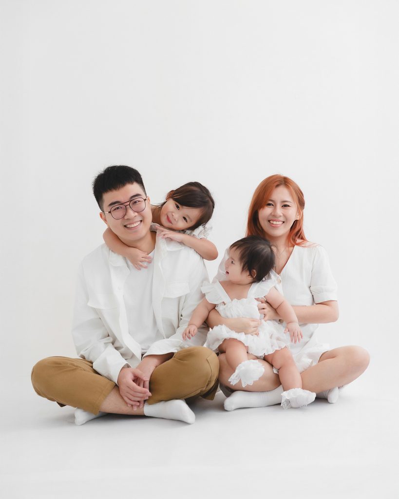 Family smiling together during a studio photoshoot