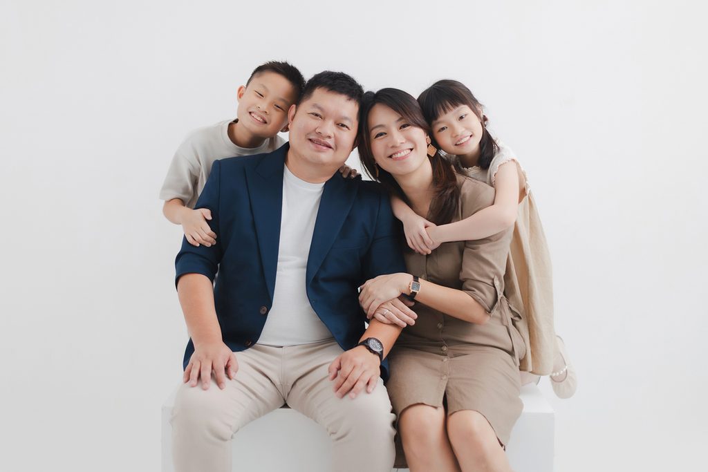 Family smiling together during a studio photoshoot